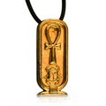 Golden cartouche oval-shaped pendant with ankh loop symbol on the top front face and a scarab beneath it. On a black necklace with white background, slight reflection of pendant beneath it.