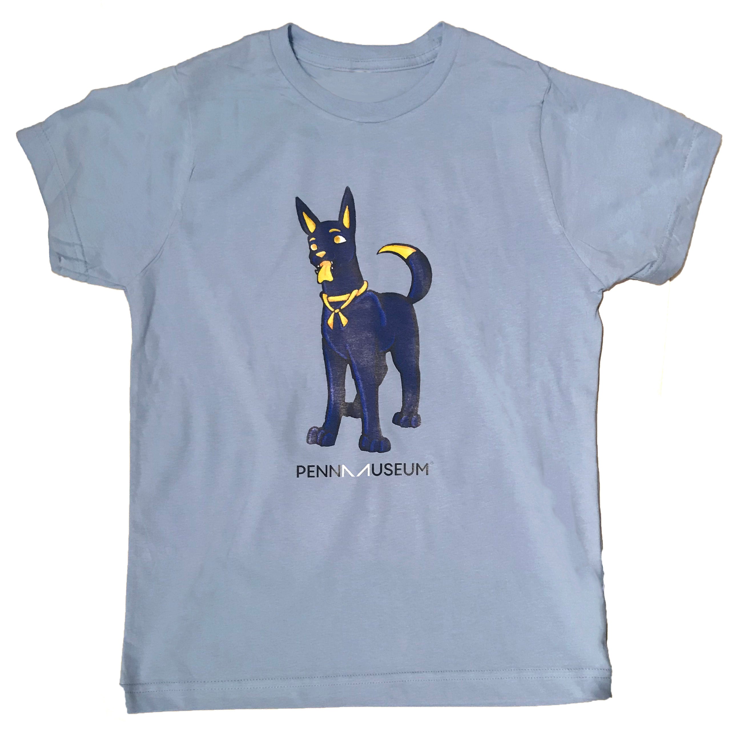 Youth-sized blue t-shirt with a graphic print of Anubis, the dog-like figure from ancient Egyptian mythology, on the front with the text 'Penn Museum'.