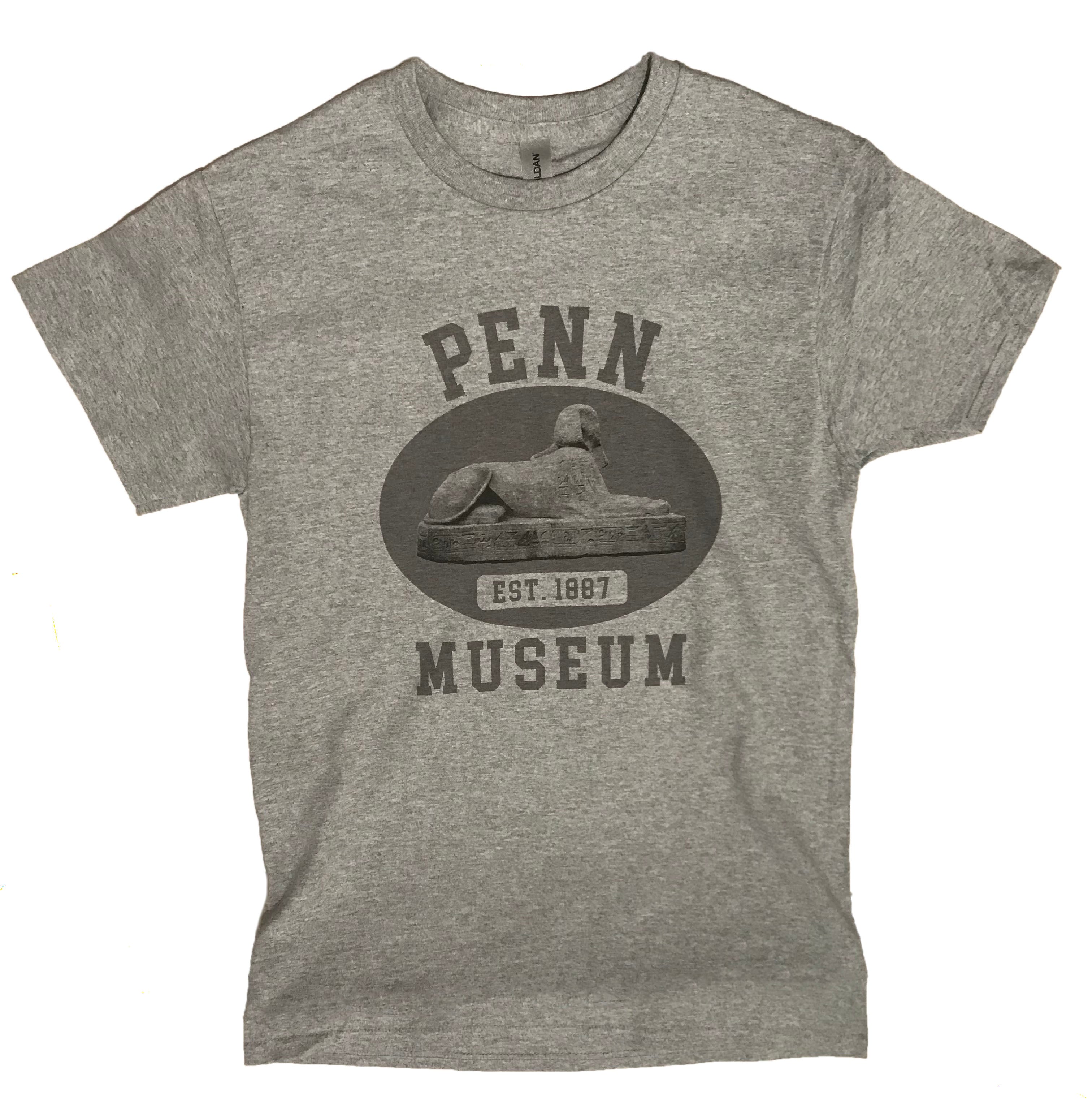 A gray t-shirt with 'PENN MUSEUM' and a graphic of a sphinx on the front.