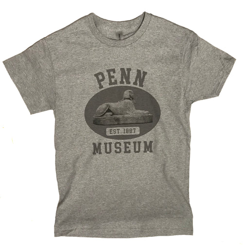 A gray t-shirt with 'PENN MUSEUM' and a graphic of a sphinx on the front.