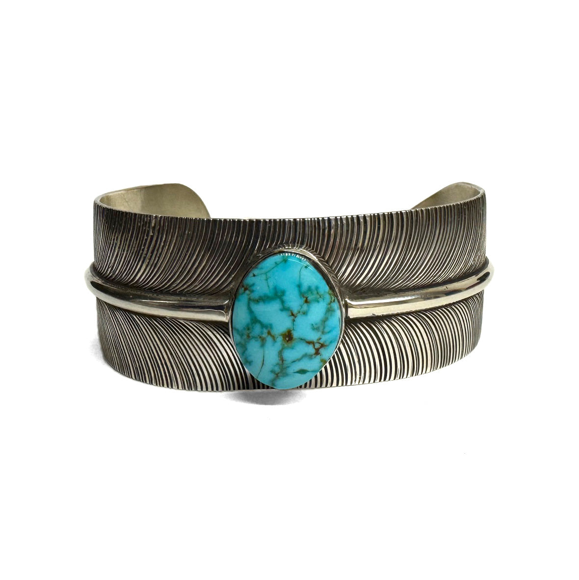 Front view of a silver bracelet with feather pattern and large turquoise stone at the center on a white background.