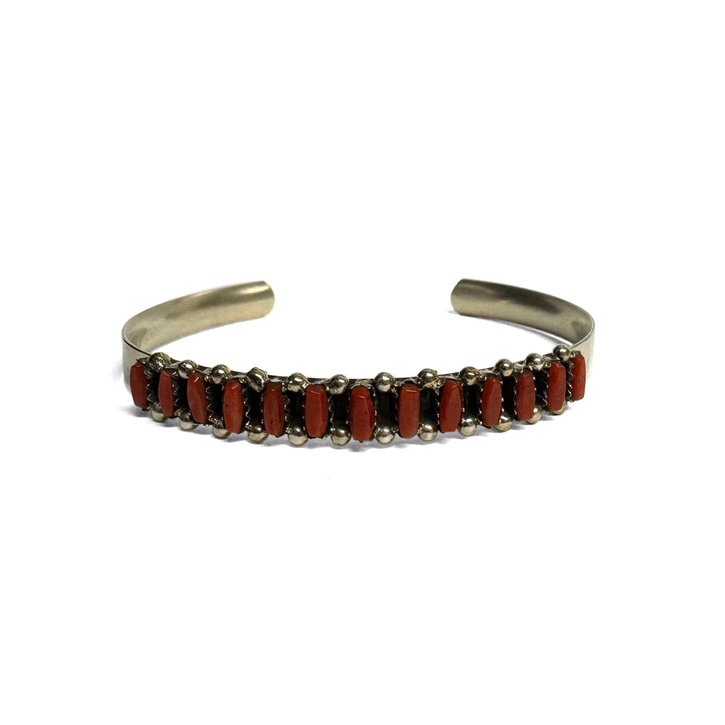 Sterling Silver bracelet with red Coral on a white background. Front view.