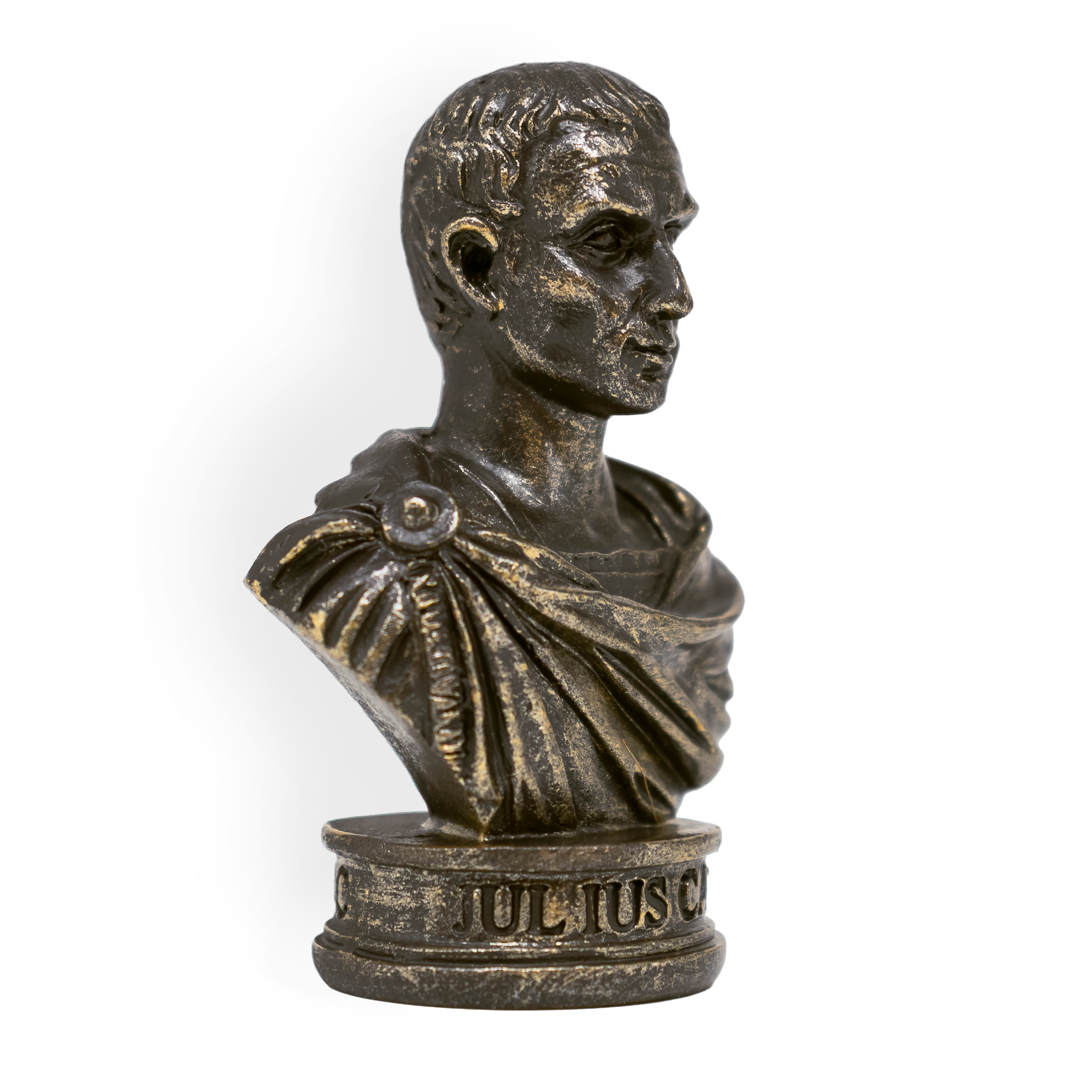 Bust statue of Julius Caesar's head and upper torso, bronze, with white background. He has a neutral, somewhat smiling expression, and is a rustic bronze color. Inscription on base "Julius" visible. 