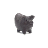 Small black piggy on a white background
