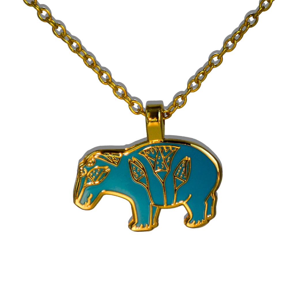 Turquoise and gold Egyptian-style enamel hippo pendant on gold chain on white background.