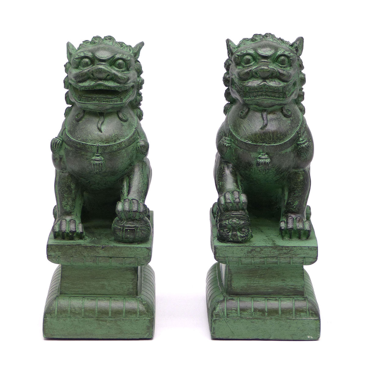 A pair of traditional Chinese Foo lions or Foo dogs, placed on bases, designed to resemble patinated bronze. Front view.